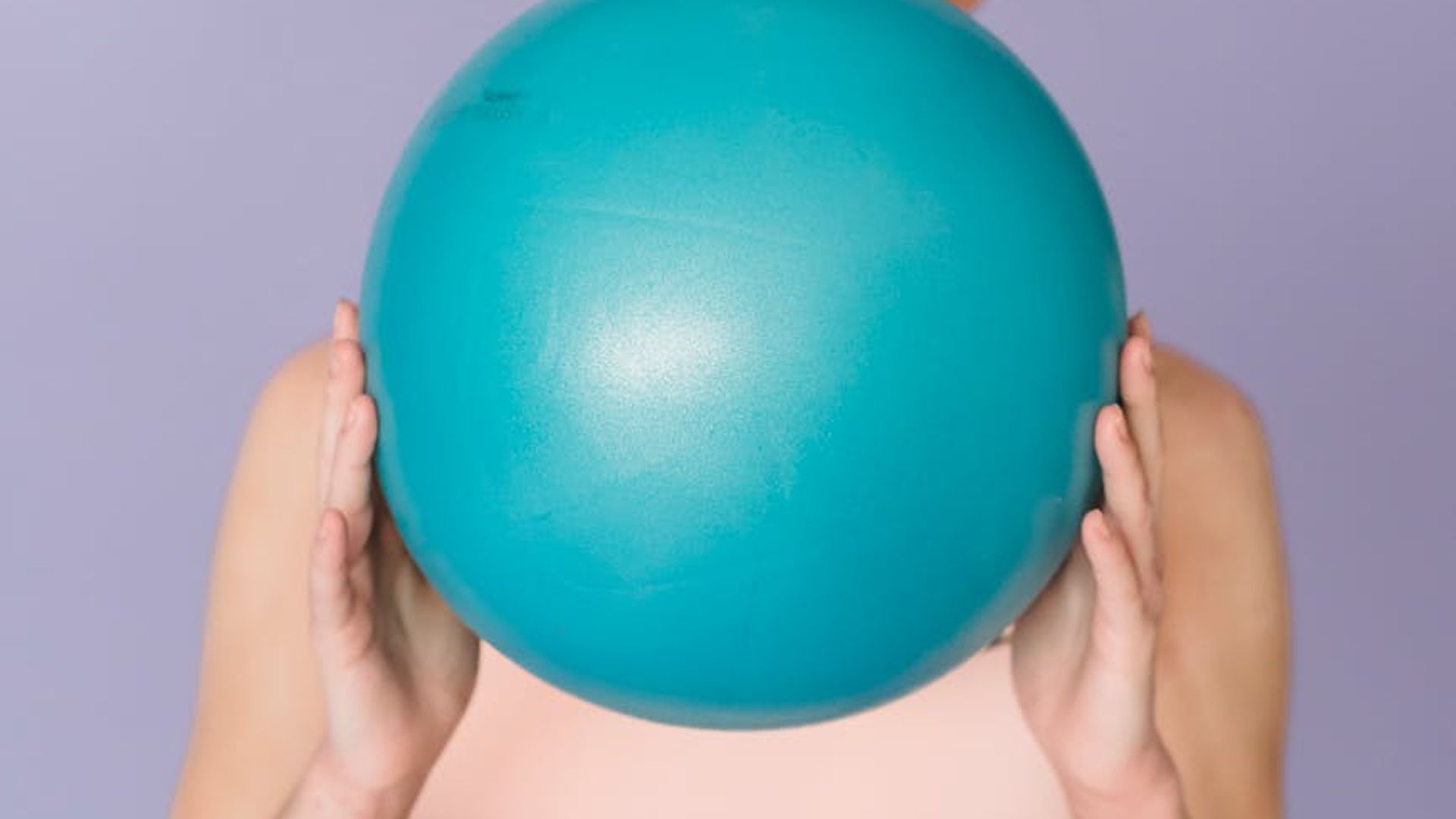 Minimalist fitness studio with soft lighting and professional equipment.